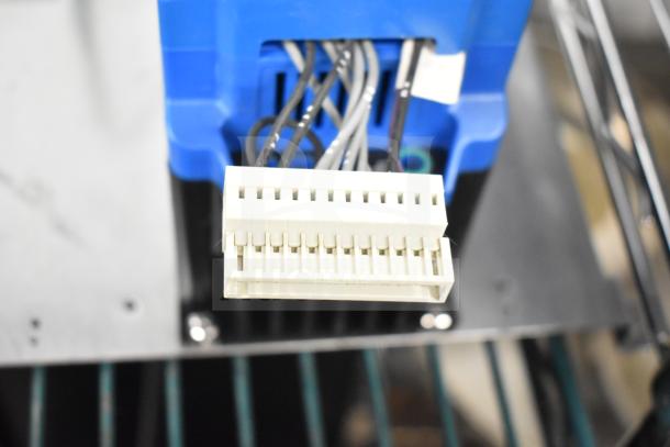 Brand new Genesis KBDF-24D AC Drive, 115/208-230V, 1 Phase, with minor scratches and dents, blue casing visible.