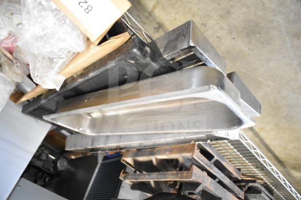 29 assorted kitchen components, including range grates and Turbochef kick plates. Items appear in used condition.