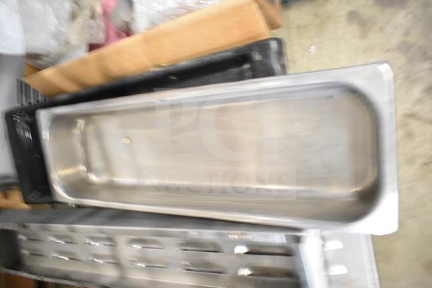 29 mixed items including metal range grates and Turbochef kick plates, shown stacked. Condition varies. Auction lot.