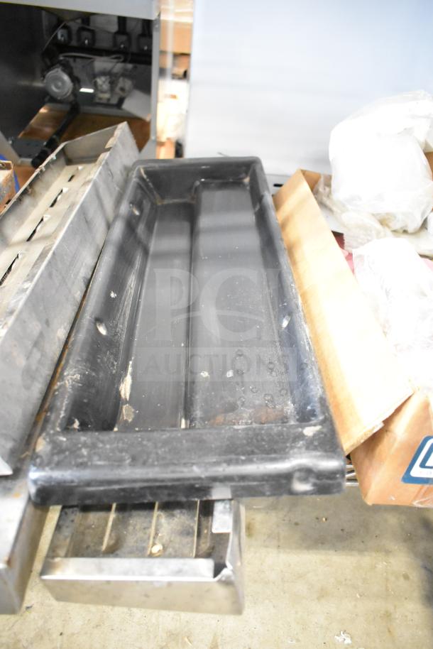 29 items including range grates and Turbochef kick plates, mixed condition, industrial setting.