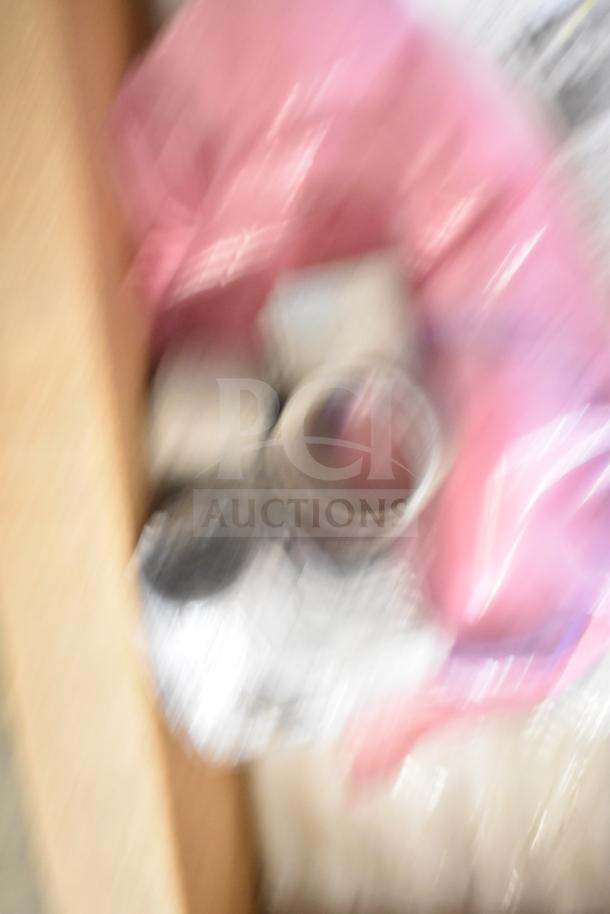 Unclear image of various items including range grates and Turbochef kick plates; 29 times your bid.