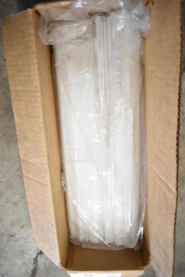 Cardboard box containing 29 various items, including range grates and Turbochef kick plates in plastic wrap.