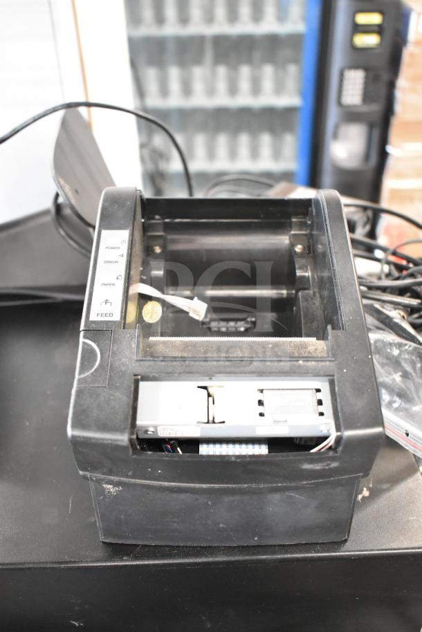 POS receipt printer in used condition, with visible cables and control panel showing power, error, and paper indicators.