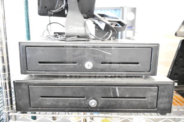 POS system with two black cash drawers, receipt printer, and Toast monitor, showing some wear. Ideal for retail use.