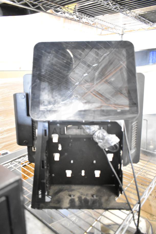 POS system with two cash drawers, receipt printer, and Toast monitor. Includes cables; suitable for retail settings.