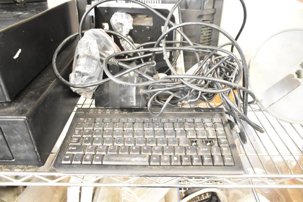 POS system with two black cash drawers, a receipt printer, Toast monitor, and keyboard. Visible cables and connectors. Used condition.