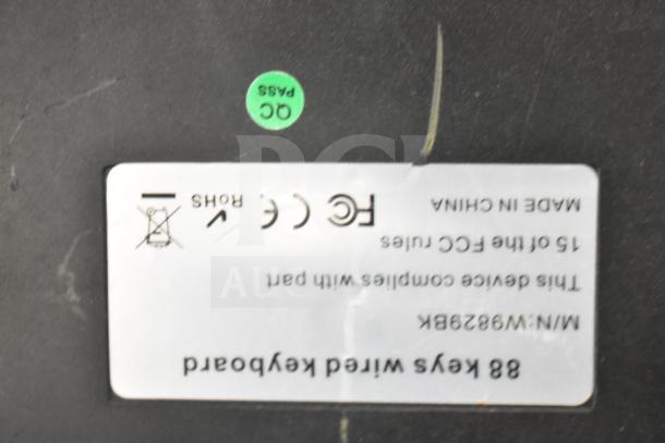 POS system with label showing "88 Keys Wired Keyboard," model number W9829BK, indicating manufacturing compliance.