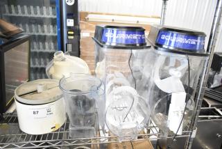 Various items include slushie machine hoppers, slicing blade, blender pitcher, and labeled equipment on metal shelves.