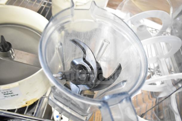 10 various items; includes slushie machine hoppers, slicing blade, blender pitcher. Items shown on a metal rack.