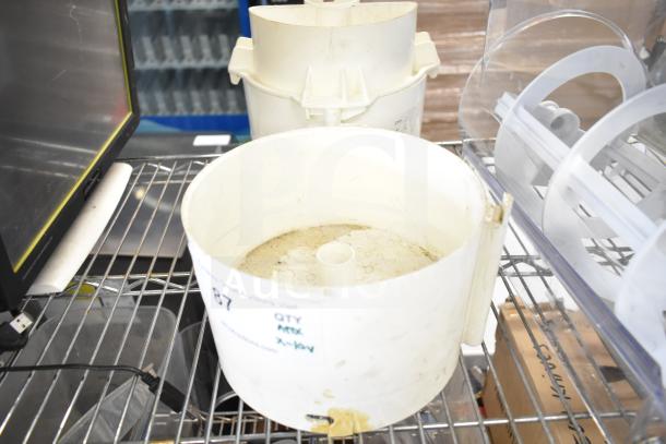 10 various items including slushie machine hoppers in used condition, with slicing blade and blender pitcher. Auction lot "10 Times Your Bid".