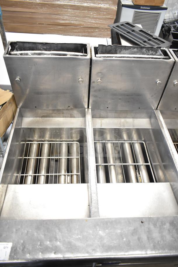Pitco Frialator 4 bay deep fryer, natural gas, 122,000 BTU, with commercial casters. Clean stainless steel, good condition.