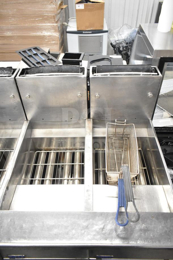 Pitco Frialator commercial 4-bay gas deep fat fryer with 122,000 BTU, on casters, used condition.