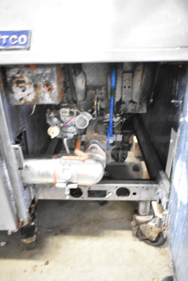 Pitco Frialator 4-bay deep fryer, natural gas powered, 122,000 BTU, on commercial casters. Visible signs of use.