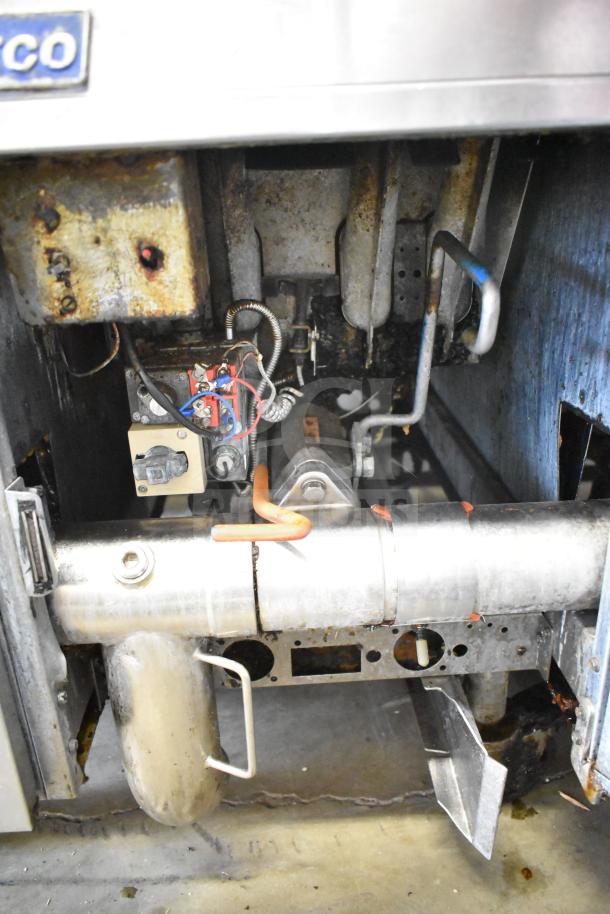 Pitco Frialator commercial natural gas 4-bay deep fryer on casters. Visible internal components with signs of use. 122,000 BTU.