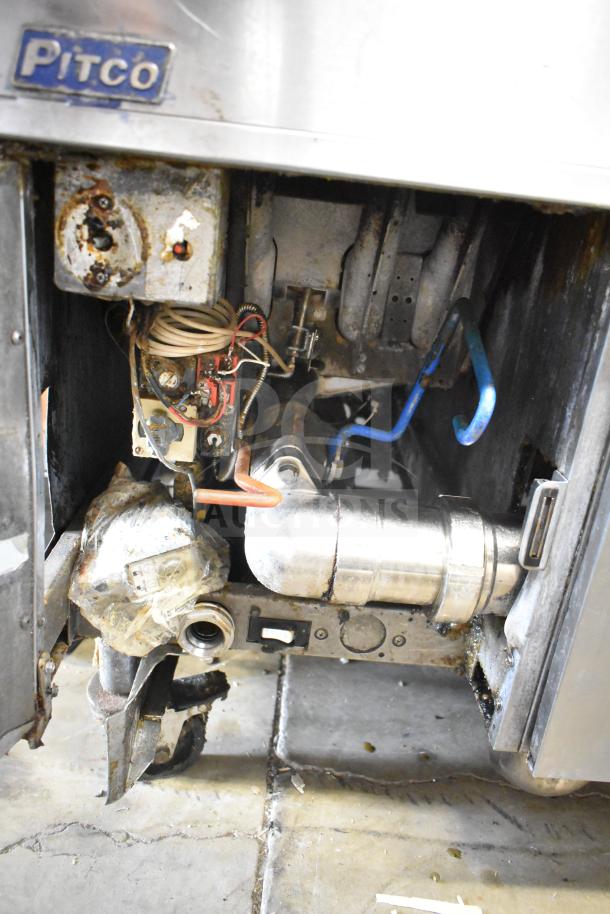 Pitco Frialator commercial 4-bay deep fat fryer, natural gas, 122,000 BTU, on casters, visible internal components, used condition.