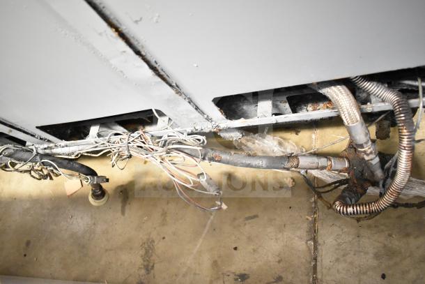 Pitco Frialator commercial 4 bay deep fat fryer with visible wiring and gas connections, 122,000 BTU, on casters.