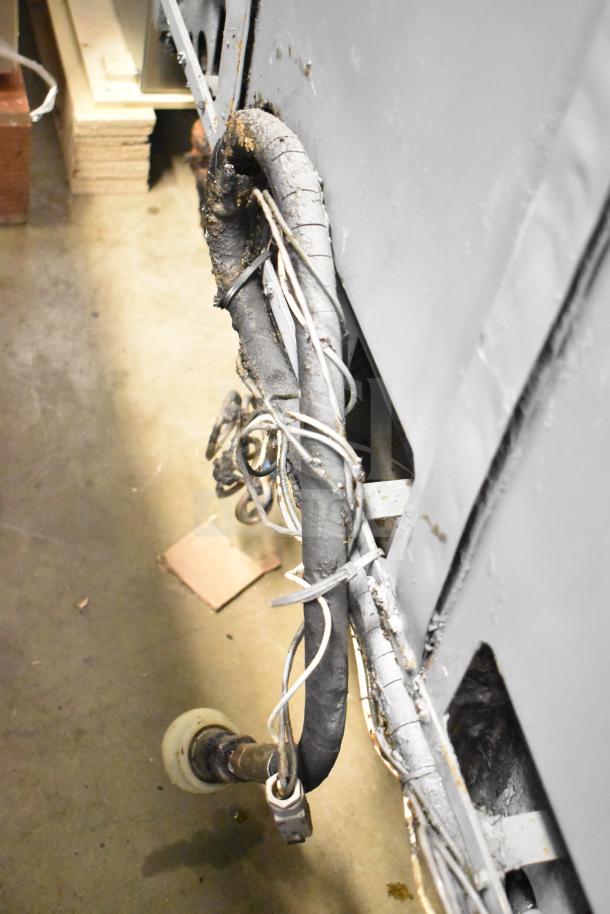 Pitco Frialator 4 bay fryer with natural gas line, showing industrial casters. 122,000 BTU, used condition.