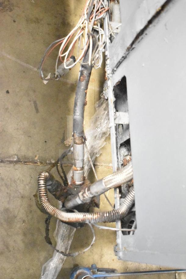 Pitco Frialator natural gas 4-bay deep fat fryer with 122,000 BTU, commercial casters. Wiring and piping shown.