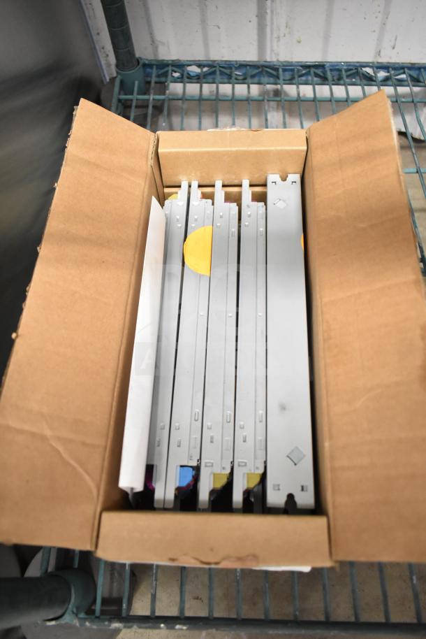 Box of brand new Advance LED Electronic Drivers, unopened, containing multiple units with visible slot connectors and labels.