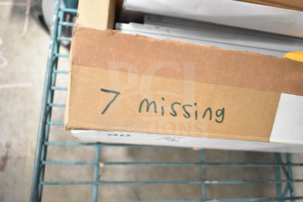 Box of Advance LED Electronic Drivers, brand new, seven units missing, cardboard box on metal shelf.