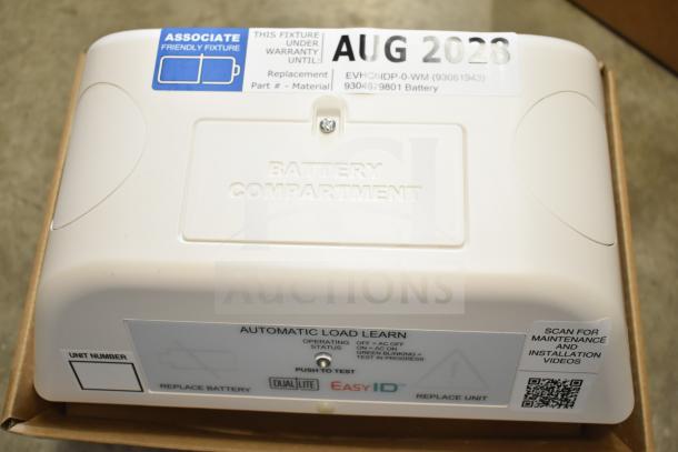 Boxed DualLite EVODW double remote head light, brand new. Features labeled battery compartment, warranty tag until Aug 2028.