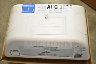 Boxed DualLite EVODW double remote head light, brand new. Features labeled battery compartment, warranty tag until Aug 2028.