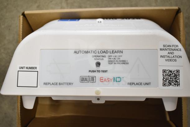 Box of DualLite EVODW Double Remote Head Light, new condition. Features EasyID, automatic load learn mode. QR code for installation.