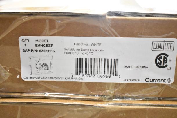 Box of DualLite EVODW Double Remote Head Light, model EVHCEZP, suitable for damp locations, color white.