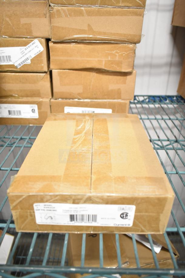 25 brand new boxes of DualLite EVHCEZP emergency lights, sealed packaging, visible product labels indicating model and certification.