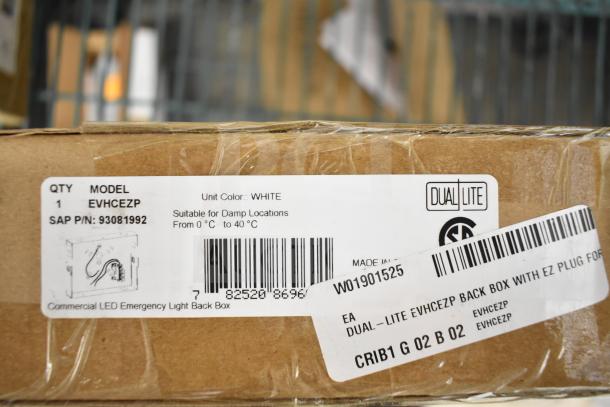 25 new boxes of DualLite EVHCEZP emergency lights, model EVHCEZP, suitable for damp locations, white color.