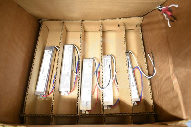 Brand new ERP VLM100W-24 ballasts in box, five units shown, with visible wiring, labels show specifications and branding.