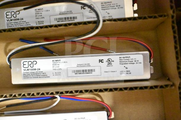 Four brand new ERP VLM100W-24 ballasts in boxes, labeled for LED drivers, max current 4A, 96W, suitable for damp locations.
