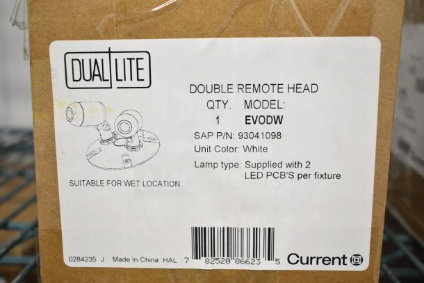 Box labeled DualLite EVODW Double Remote Head Light, suitable for wet locations, in white, with two LED PCBs.