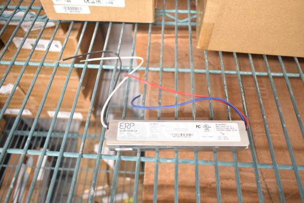 11 brand new boxes on shelves, featuring DualLite EVODW Double Remote Head Light, EBP Ballasts, and DualLite DYN6I-WM.