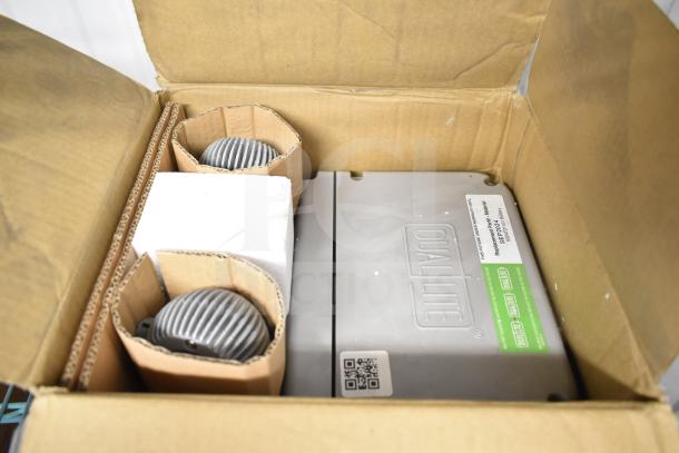 Brand new box containing DualLite EVODW Double Remote Head Light and DYN6I-WM. Includes EBP Ballasts. Visible DualLite label.