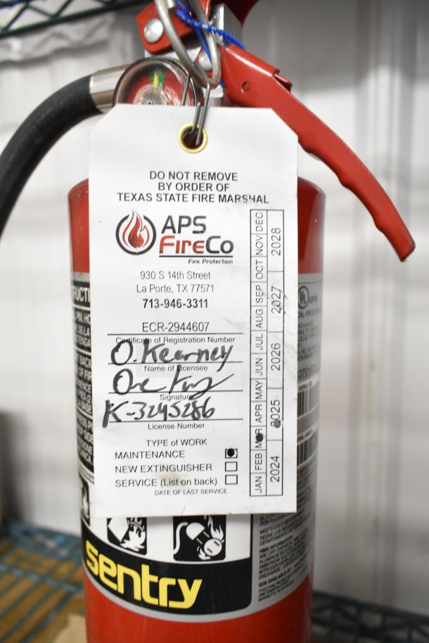 Brand new Sentry fire extinguisher with inspection tag from APS FireCo. Includes registration and maintenance details.
