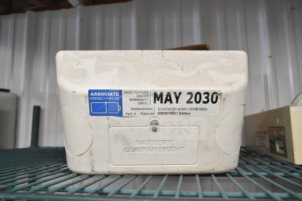 Emergency light fixture; warranty until May 2030; includes battery compartment; model EVHC6IDP-0-WM; associate friendly.