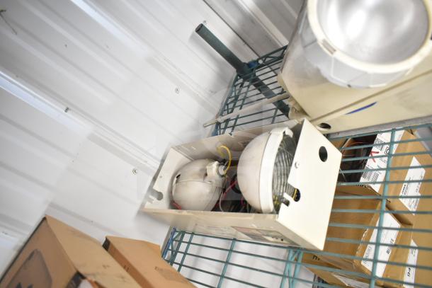 6 mixed items, including an emergency light, on a metal shelf. Some items appear boxed. Various conditions.