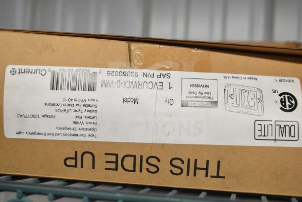 Box of emergency lighting by Current, model EVOURWDI-0-WM, with Dual Lite branding. Features and specs on label.