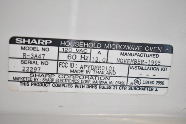 Sharp Carousel R-3A47 Countertop Microwave Oven with plate, 120V, 1 Phase, model R-3A47, made in Thailand, November 1995.
