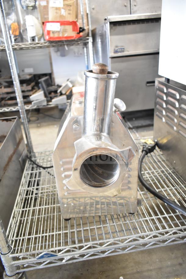 Avantco MG22 Commercial Meat Grinder, stainless steel, 110V, 1 Phase, on metal shelf. Clean, minor wear visible.