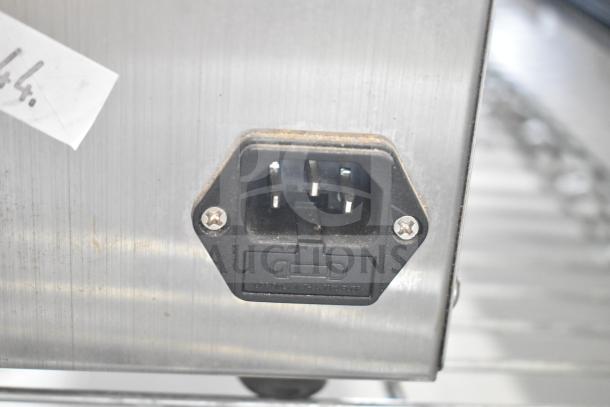 VacPak-It 186VME16SS External Vacuum Packaging Machine power plug on stainless steel surface. 120V, 1 Phase. Visible wear.