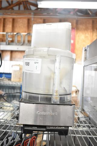 Cuisinart countertop food processor with S blade and bowl, 120 volts, 1 phase. Model features stainless steel base, visible use marks.