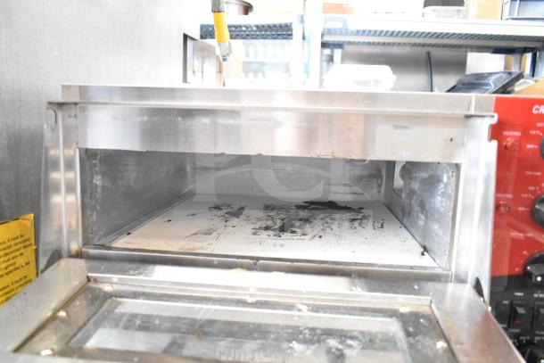 2023 Crosson CPO-320 countertop electric 2-deck pizza oven, stainless steel, visible signs of use, heating controls on side.