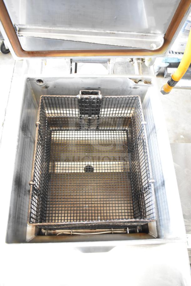 2022 Henny Penny 600 commercial pressure fryer, natural gas, 80,000 BTU, on casters. Clean condition with visible basket.
