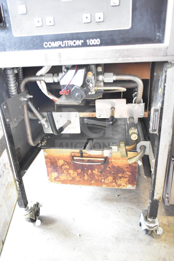 2022 Henny Penny 600 commercial natural gas pressure fryer on casters, 80,000 BTU, moderate wear, Computron 1000 panel.