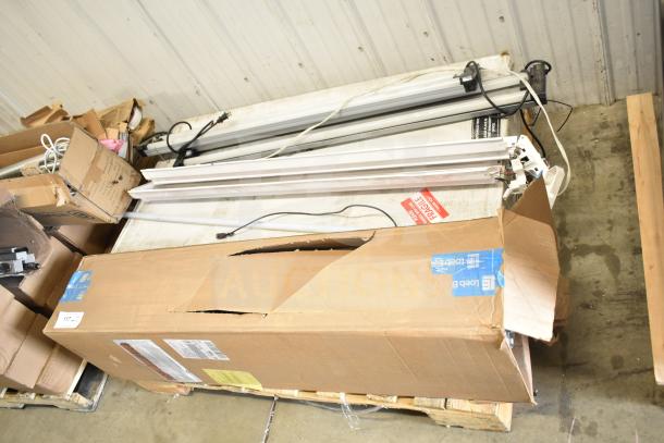 Cardboard box containing Philips tube lights and PT44070 2x4 LED Light Panel. Six items total. Box shows wear.