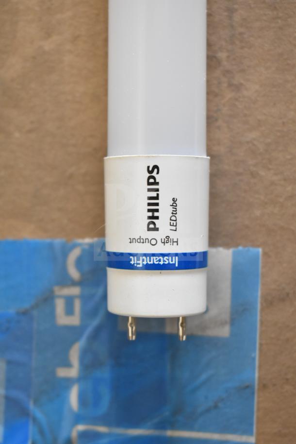 Philips LEDtube light, high output, visible pins. Label indicates "InstantFit." Ideal for energy-efficient lighting.