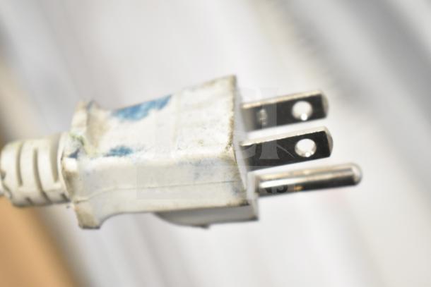 Plug close-up with visible wear and blue stains, associated with auction lot of 6 items including Philips Tube Lights and PT44070 2x4 LED Light Panel.