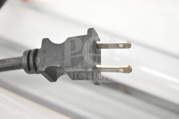 Power plug from a Philips light setup, possibly part of the PT44070 2x4 LED light panel auction bundle.